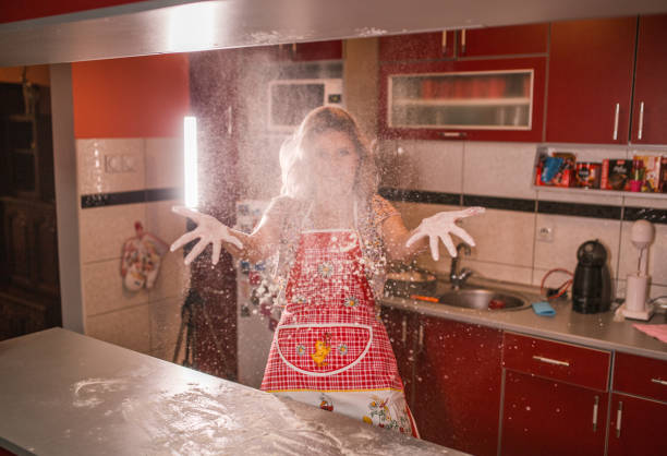 istock Happy woman having fun in the kitchen 1370060463