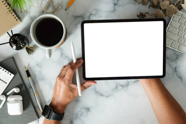 istock Man hands holding digital tablet with white screen and stylus pen. 1370061278