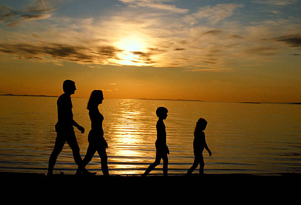 Family Walking Beach stock photo
