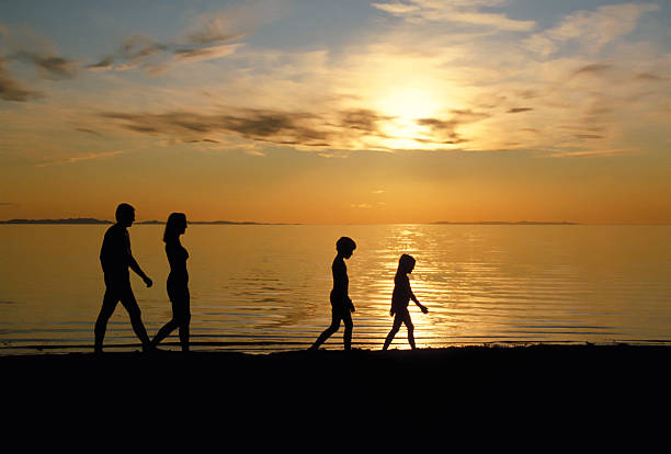 Family Walking Beach 2 stock photo