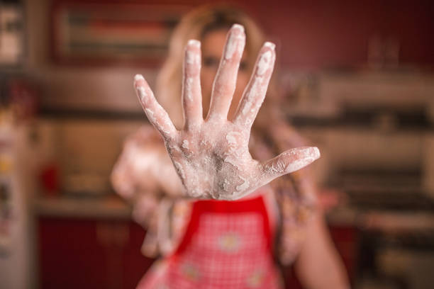 istock Woman with floury hands 1370067639