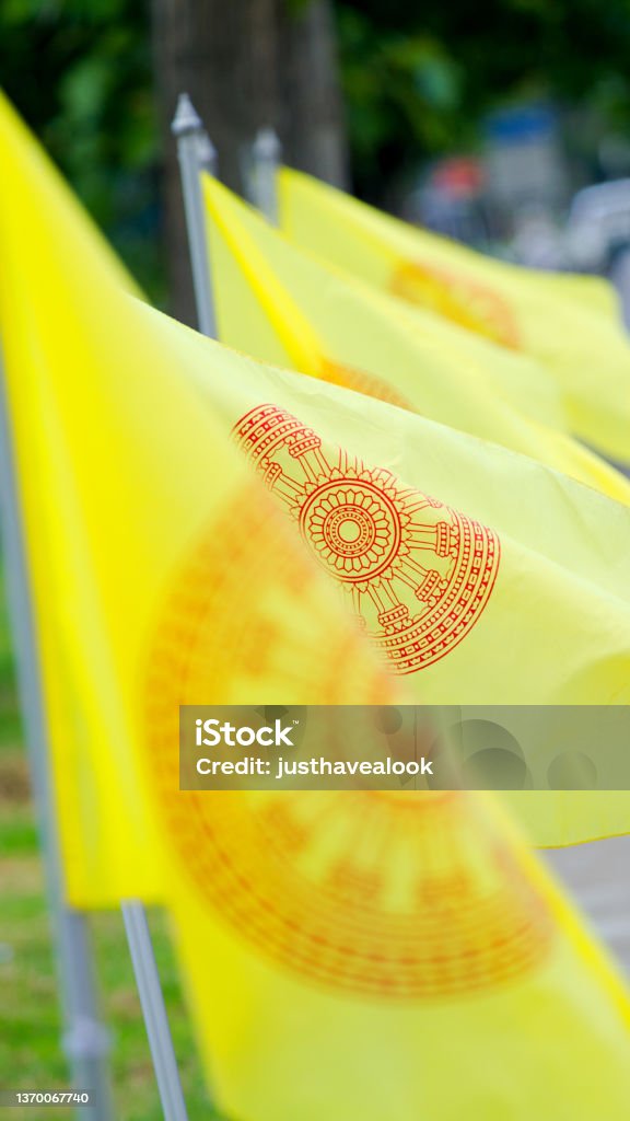 Yellow traditional thai flags with wheel of time Buddhism Stock Photo