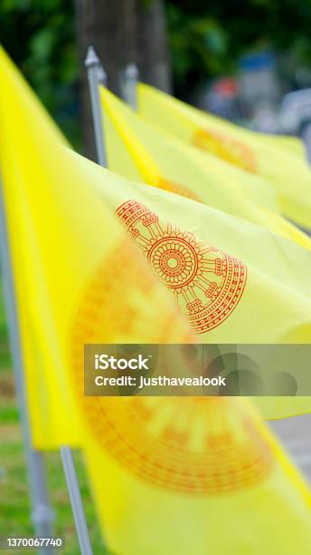 Yellow Traditional Thai Flags With Wheel Of Time Stock Photo - Download Image Now - Buddhism, Color Image, Copy Space