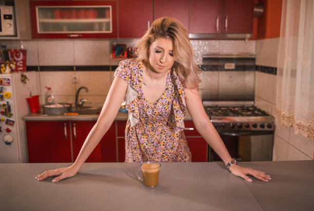 istock Young housewife enjoying a coffee break in the kitchen 1370068649