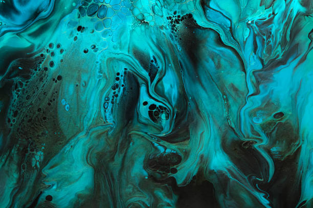 istock Fluid Art. Green and blue abstract wave swirls on black background. Marble effect background or texture 1370072102