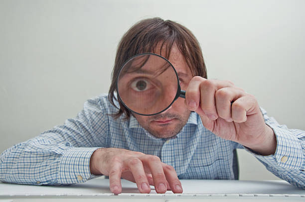 istock Businessman with magnifying glass 137007331