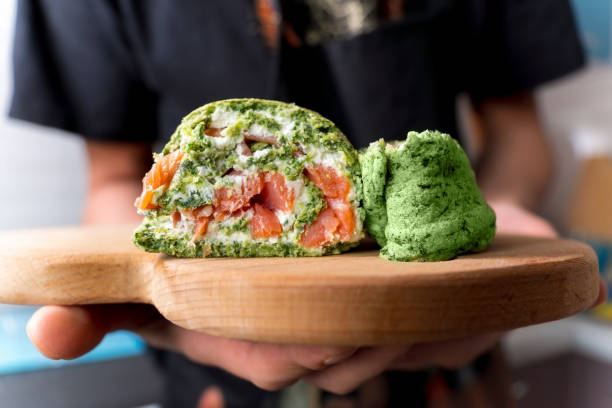istock Rolls a baked biscuit cake with spinach and mint. Swiss roll. Selective focus 1370076634