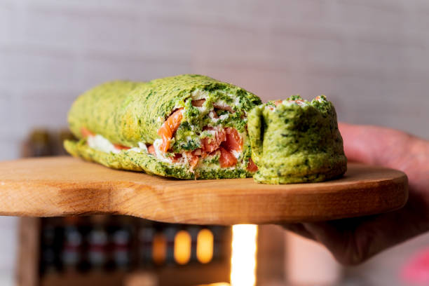 Rolls a baked biscuit cake with spinach and mint. Swiss roll. Selective focus