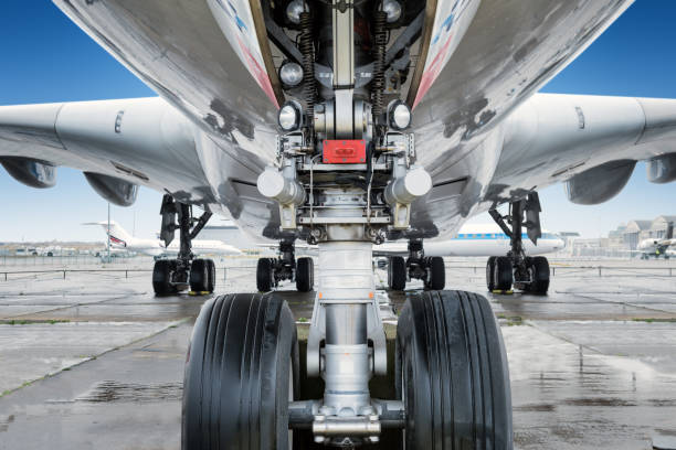 close view of landing gear under a big jet plane