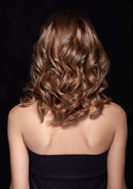 istock Woman from backside with curly hair 1370081837