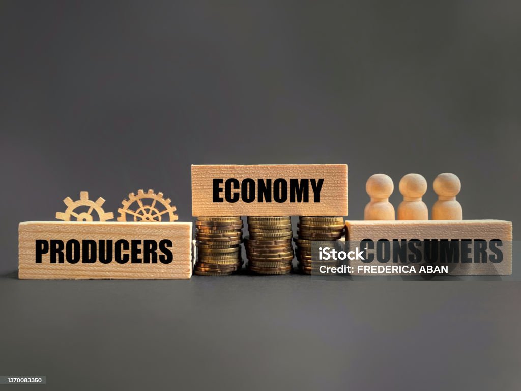 Economic System Concept PRODUCERS ECONOMY CONSUMERS text background. Stock photo. Consumerism Stock Photo