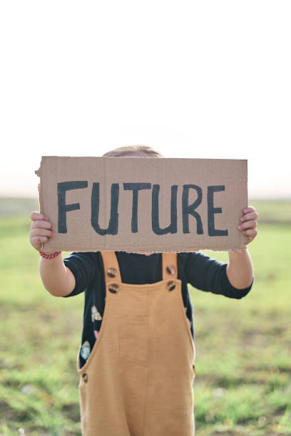 istock girl holding a sign that says future 1370093045