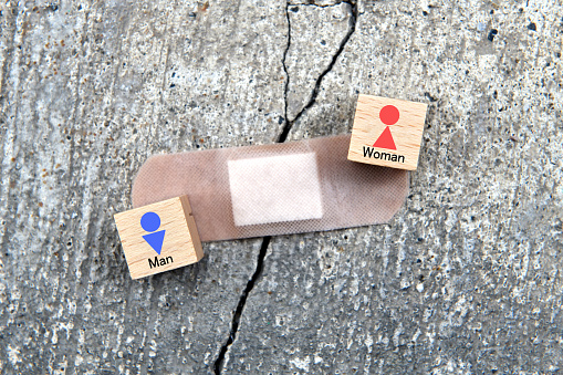 Improvement for human relationship images, wooden blocks with human pictogram and adhesive plaster on crack