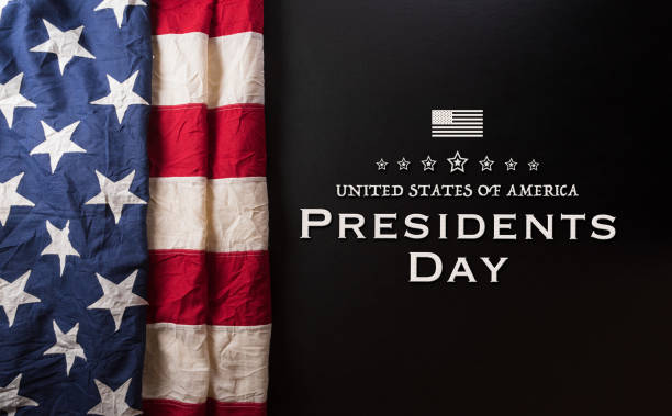 Happy presidents day concept with flag of the United States and the text on dark  background. Happy presidents day concept with flag of the United States and the text on dark  background. presidents day weekend stock pictures, royalty-free photos & images
