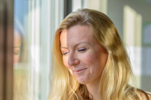 istock Preoccupied worried woman looking down 1370100445