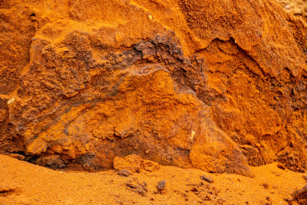 istock Textural sand, with  relief surface, multi-colored layers and different in size of granules, in outdoor sand career, after mining ore and sand for construction. 1370101099