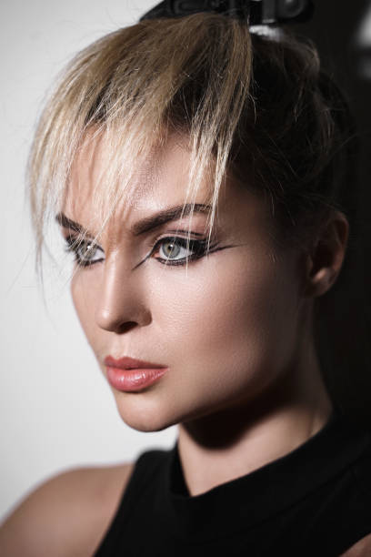 istock Fashion model with a creative makeup and hairstyle 1370101544