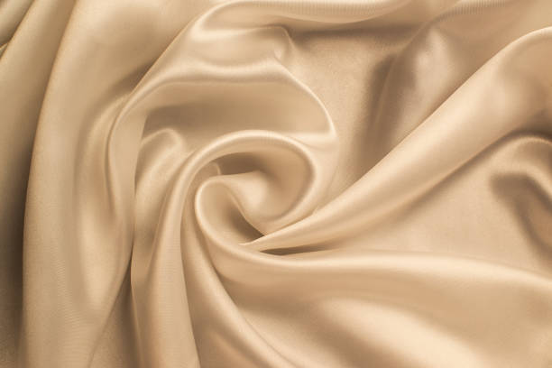 istock delicate texture of cream-colored silk fabric 1370104529