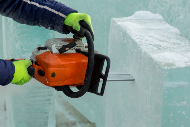 istock Hands of a fitter with a chainsaw at a construction site 1370108629