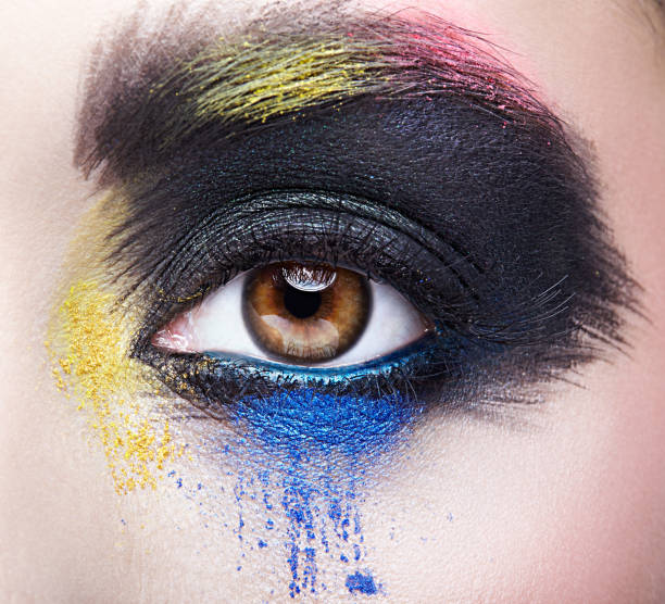 istock Female eye with unusual artistic painting makeup 1370109762