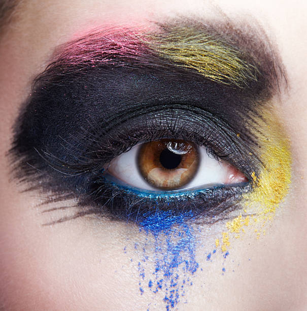 istock Female eye with unusual artistic painting makeup 1370109764