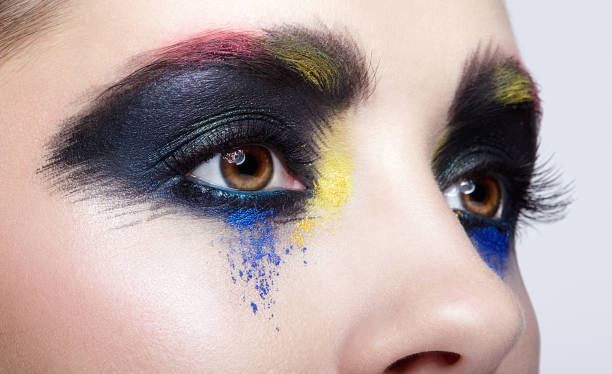 istock Female eye with unusual artistic painting makeup 1370109818