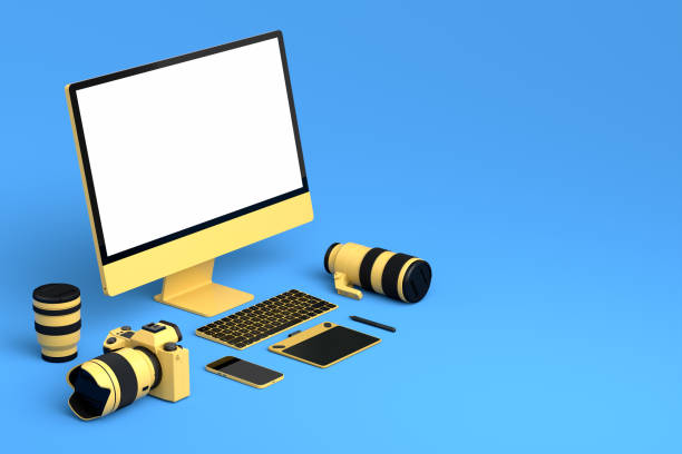 istock Desktop computer with keyboard, tablet, phone and DSLR camera on blue background 1370113865
