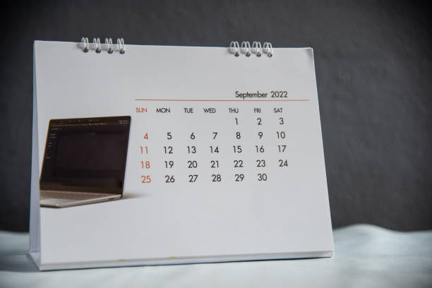 istock White calendar in dark tone. 1370118436