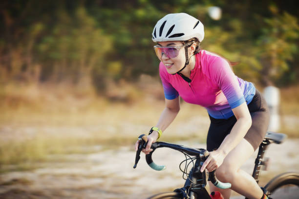 istock Asian female cyclist cycling at speed 1370119446