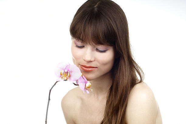 woman with an orchid stock photo