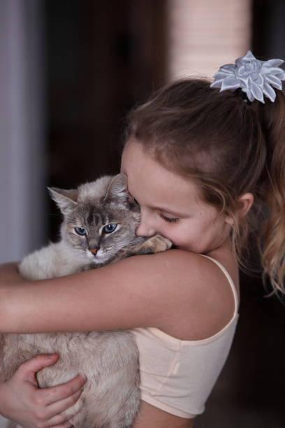 istock child with a pet cat in hands 1370125198