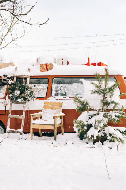 istock Snow covered van in winter camp, with Christmas decoration. 1370126141
