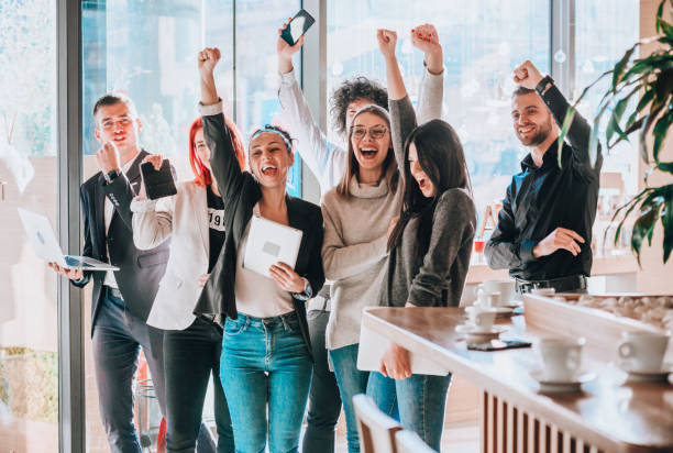 istock Group of business colleagues with raising hands 1370127156