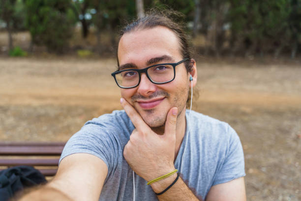 istock Smiling man taking a selfie with his smartphone 1370128665