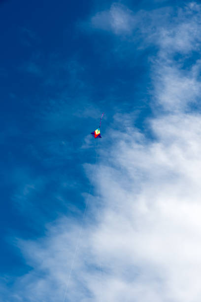 istock Colorful Kites flying over the sky 1370129886
