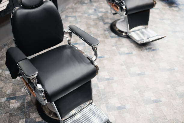 istock Empty chair at barber shop 1370130244