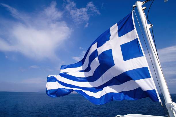 istock Greek flag waving on a ferry boat 1370131731