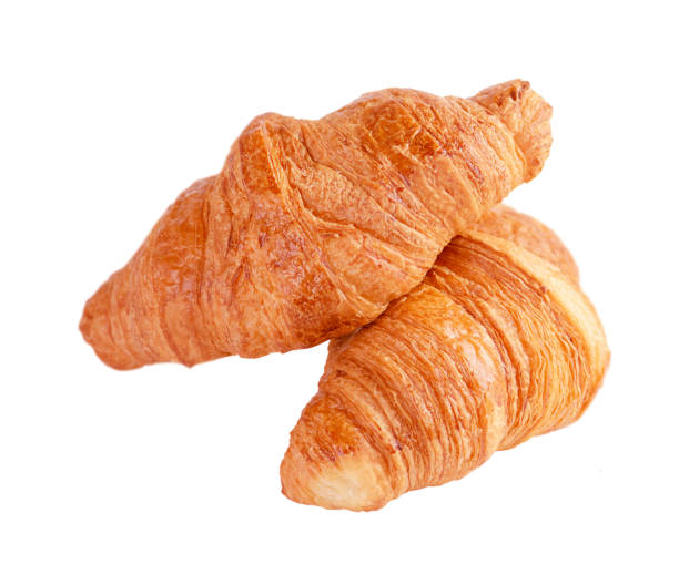 istock Two fresh french croissants isolated on white background. 1370132773