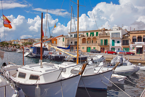 Waterfront with boats at Porto Colom town in Mallorca island