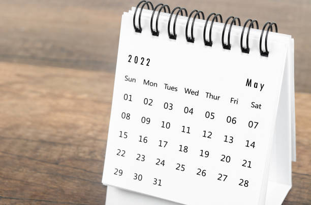 istock May 2022 desk calendar on wooden background. 1370133043