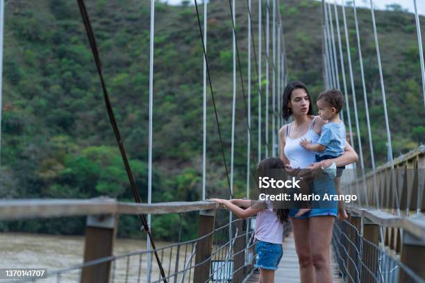 Family Tourism On The Western Bridge In Sanata Fe De Antioquia Colombia Stock Photo - Download Image Now