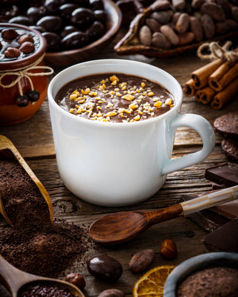istock Melted hot chocolate cup and cocoa beans and pod with assorted chocolate 1370148920