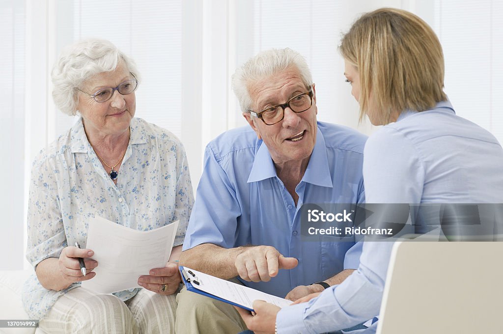 Bank investments and savings Business agent planning with a retired couple their future investments. Senior Adult Stock Photo