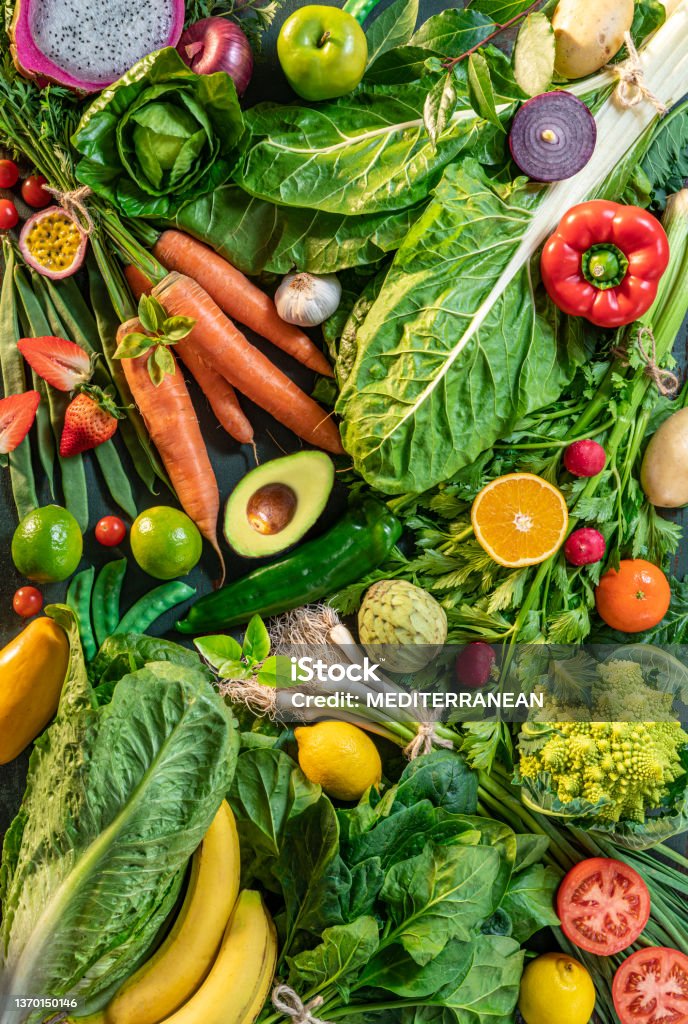 Fruits and vegetables assorted full frame background featuring leaf vegetables Fruits and vegetables assorted full frame background featuring many leaf vegetables Vegetable Stock Photo