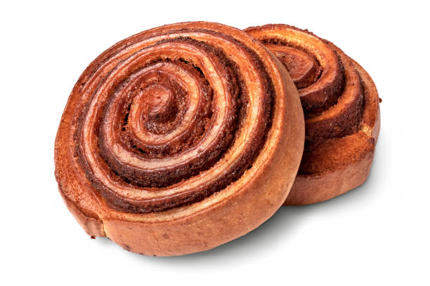 Traditional round cinnamon baked roll Isolated objects: traditional round cinnamon baked roll, on white background CINNAMON ROLL stock pictures, royalty-free photos & images