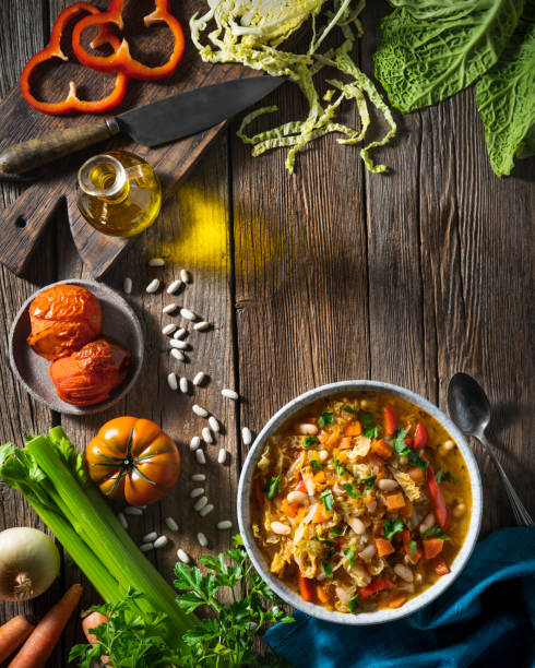 istock Vegetable Cabbage Soup vegan ingredients celery, beans, bell pepper, carrots, parsley and tomatoes 1370152952