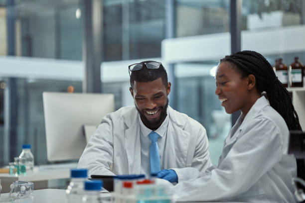 istock Shot of two scientists working together on a digital tablet in a lab 1370154323