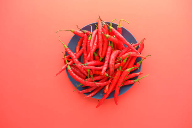 istock red chili pepper on a plate on red background 1370159358