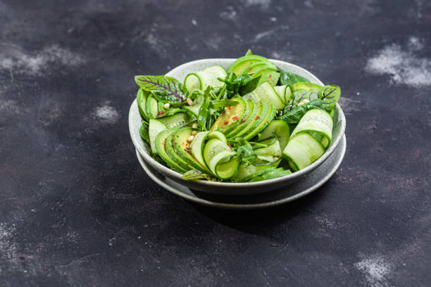 istock Vegetarian salad with avocado, cucumber and herbs 1370164527