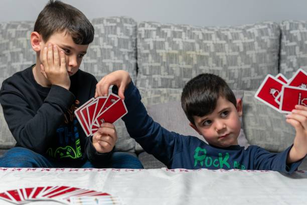 istock Two young rivals taking some red cards to prepare a great master move. 1370164568